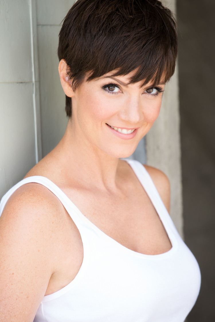 Zoe McLellan smiling and wearing white top